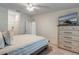 Inviting main bedroom with soft bedding, a mounted TV, and a view of the ensuite bathroom at 14267 Heritage Landing Blvd # 1223, Punta Gorda, FL 33955