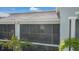 The screened lanai has views of the community and a seating area at 14267 Heritage Landing Blvd # 1223, Punta Gorda, FL 33955
