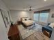 Calm bedroom featuring a cozy bed and soft decor at 15431 Orangeade Dr, Punta Gorda, FL 33955