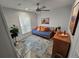 Cozy bedroom featuring a daybed, ceiling fan, and stylish accents for a relaxing atmosphere at 15431 Orangeade Dr, Punta Gorda, FL 33955