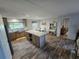 Bright kitchen boasts an island, stainless steel appliances, and sleek countertops for a modern feel at 15431 Orangeade Dr, Punta Gorda, FL 33955