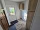This mud room offers convenient storage with built-in cabinets and a bench for added functionality at 15431 Orangeade Dr, Punta Gorda, FL 33955