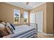 Bedroom showcases a twin bed, closet, and two windows with natural light at 16232 Quesa Dr, Punta Gorda, FL 33955
