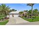 Charming home with a white tile roof, a spacious driveway, and beautifully manicured landscaping at 16232 Quesa Dr, Punta Gorda, FL 33955