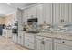 A well-appointed kitchen with granite countertops, tiled backsplash, and modern appliances at 16232 Quesa Dr, Punta Gorda, FL 33955