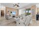 A sunlit living room showcases neutral tones, comfortable seating, and a view to the outdoors at 16232 Quesa Dr, Punta Gorda, FL 33955