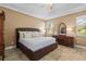The main bedroom features a trey ceiling, tiled floor, and neutral colors at 16232 Quesa Dr, Punta Gorda, FL 33955