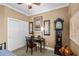 Office space showcases an antique desk, chair, grandfather clock and closet at 16232 Quesa Dr, Punta Gorda, FL 33955