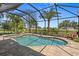 Picturesque pool with clear water, lush landscaping and a relaxing atmosphere at 16232 Quesa Dr, Punta Gorda, FL 33955