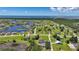 Expansive aerial view showcasing a residential community with waterfront properties, lakes, and green spaces at 16615 Acapulco Rd, Punta Gorda, FL 33955