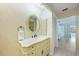 Bathroom with modern vanity and marble countertop and bright natural light at 16615 Acapulco Rd, Punta Gorda, FL 33955