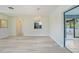 Spacious dining room featuring sleek floors with a view into the kitchen and a sliding door to the outside at 16615 Acapulco Rd, Punta Gorda, FL 33955