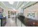 Open kitchen with granite countertops, skylight, white cabinets, and eat-in dining space at 16615 Acapulco Rd, Punta Gorda, FL 33955