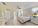 Light and airy main bedroom featuring white furnishings and sliding glass door at 16615 Acapulco Rd, Punta Gorda, FL 33955
