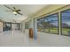Spacious sunroom overlooking backyard and flowing into the kitchen and dining area at 16615 Acapulco Rd, Punta Gorda, FL 33955