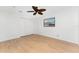 Bright bedroom features a ceiling fan, closet, and a window at 18111 Lake Worth Blvd, Port Charlotte, FL 33948