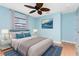 Serene bedroom boasting a queen bed, ceiling fan, and stylish decor at 18111 Lake Worth Blvd, Port Charlotte, FL 33948