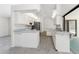 Bright kitchen featuring stainless steel appliances, white cabinets, and a breakfast bar at 18111 Lake Worth Blvd, Port Charlotte, FL 33948