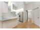 Bright kitchen with stainless appliances, light countertops, and wood-look floors at 18111 Lake Worth Blvd, Port Charlotte, FL 33948