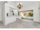 Modern kitchen with white cabinetry, tile flooring, and a view of the pool area at 18111 Lake Worth Blvd, Port Charlotte, FL 33948