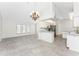 Open floor plan features a living area and kitchen with stainless steel appliances at 18111 Lake Worth Blvd, Port Charlotte, FL 33948