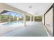 Covered patio that overlooks a large pool and green backyard at 18111 Lake Worth Blvd, Port Charlotte, FL 33948