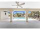 View of the refreshing screened-in pool with clear blue water, surrounded by a spacious patio area at 18111 Lake Worth Blvd, Port Charlotte, FL 33948