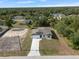 Charming single-story home with a well-manicured front yard and a long driveway at 19092 Woodbine Ave, Port Charlotte, FL 33954
