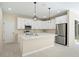 Kitchen featuring stainless appliances, granite countertops, and modern pendant lights at 19092 Woodbine Ave, Port Charlotte, FL 33954