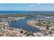 Extensive aerial view highlighting the neighborhood homes and their waterfront location and canal access at 211 E Tarpon Nw Blvd, Port Charlotte, FL 33952
