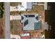 Aerial view of home with solar panels, pool, dock and a circular driveway at 211 E Tarpon Nw Blvd, Port Charlotte, FL 33952