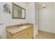 Bathroom with granite countertop, framed mirror and tile floors at 211 E Tarpon Nw Blvd, Port Charlotte, FL 33952