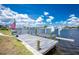 Dock with boat lift extending into the canal, perfect for boating enthusiasts and waterfront living at 211 E Tarpon Nw Blvd, Port Charlotte, FL 33952