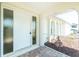 Inviting front entrance with a screened entryway and a well-manicured garden at 211 E Tarpon Nw Blvd, Port Charlotte, FL 33952