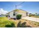 A well-kept garage exterior with landscape elements at 211 E Tarpon Nw Blvd, Port Charlotte, FL 33952