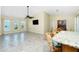 Open floor plan with living area, chandelier, breakfast bar and an abundance of natural light at 211 E Tarpon Nw Blvd, Port Charlotte, FL 33952