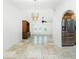 Open concept living area with vaulted ceilings, tiled floors, and views into the kitchen at 211 E Tarpon Nw Blvd, Port Charlotte, FL 33952