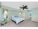 Calming main bedroom with coastal decor and ceiling fan at 211 E Tarpon Nw Blvd, Port Charlotte, FL 33952