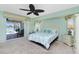 Main bedroom with slider to outdoor pool and water view at 211 E Tarpon Nw Blvd, Port Charlotte, FL 33952