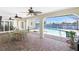 Covered outdoor patio featuring pool and water views at 211 E Tarpon Nw Blvd, Port Charlotte, FL 33952