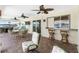 Outdoor patio featuring a bar area, wicker furniture, and waterfront views at 211 E Tarpon Nw Blvd, Port Charlotte, FL 33952
