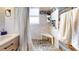 This bathroom showcases a tiled shower with built-in bench and unique brick flooring at 2142 Gerard Ct, Port Charlotte, FL 33952