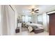 Comfortable bedroom with ceiling fan, multiple windows, a queen bed, and soft decor at 2142 Gerard Ct, Port Charlotte, FL 33952