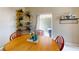 Cozy dining area featuring a wooden table, stylish decor, and seamless access to a relaxing outdoor patio at 2142 Gerard Ct, Port Charlotte, FL 33952