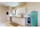Bright kitchen features stainless steel appliances, white cabinets, and granite countertops at 2142 Gerard Ct, Port Charlotte, FL 33952