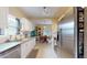 Kitchen and dining area features stainless steel appliances, white cabinets, and a wooden table at 2142 Gerard Ct, Port Charlotte, FL 33952