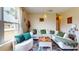 Cozy living room with plush seating, a stylish area rug, and large windows providing plenty of natural light at 2142 Gerard Ct, Port Charlotte, FL 33952