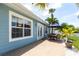 Outdoor patio features dining area with outdoor furniture and water views at 21812 Edgewater Dr, Port Charlotte, FL 33952