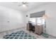 Bright bedroom with light wood floors, modern decor, and a comfortable workspace at 21812 Edgewater Dr, Port Charlotte, FL 33952