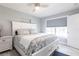 Bedroom featuring a full bed, bright natural lighting, and tile floors at 21812 Edgewater Dr, Port Charlotte, FL 33952